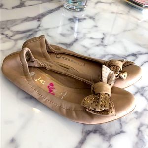 Jeffrey Campbell tan ball slippers with gold grommets on bow